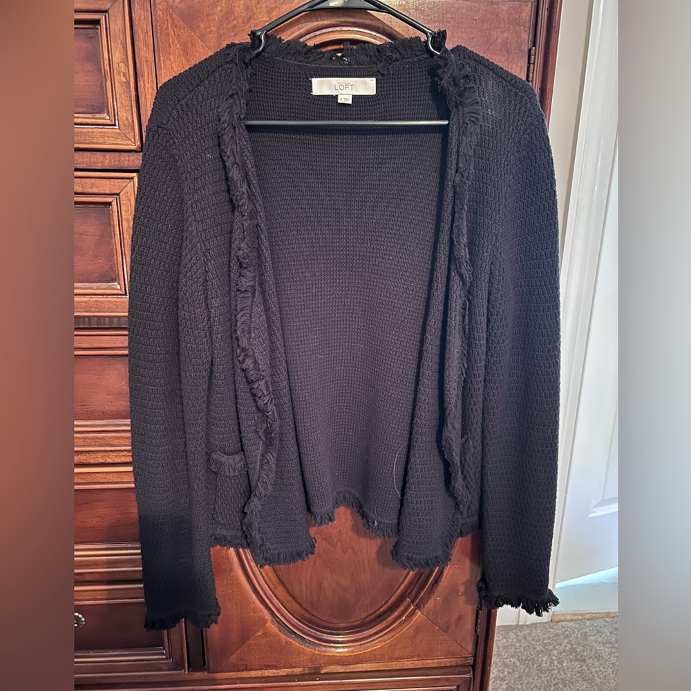 Black sweater with fringe edges (no button or zipper)